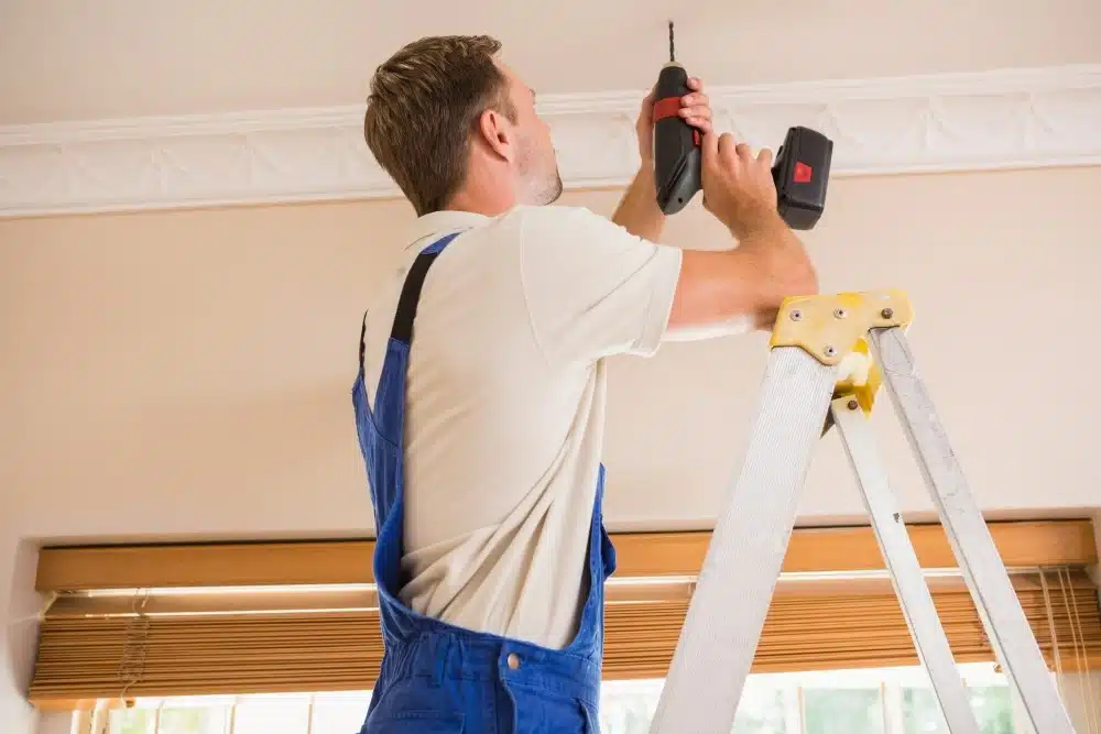 A skilled handyman repairing a home with modern tools and equipment