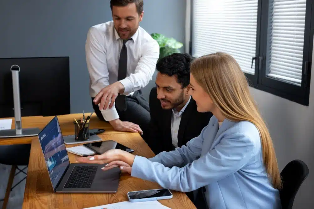 A team of professionals working collaboratively in a modern office